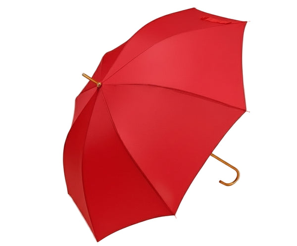 Red umbrella with a gold handle on a beige background