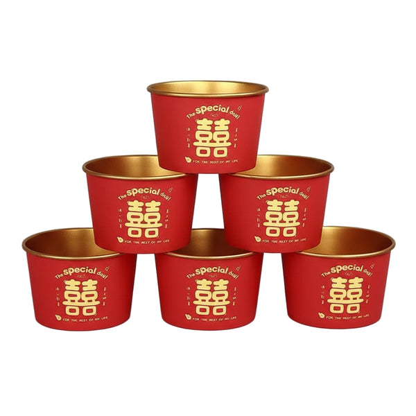 Red and gold containers with Chinese characters on a red background