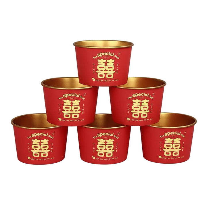 Red and gold containers with Chinese characters on a red background