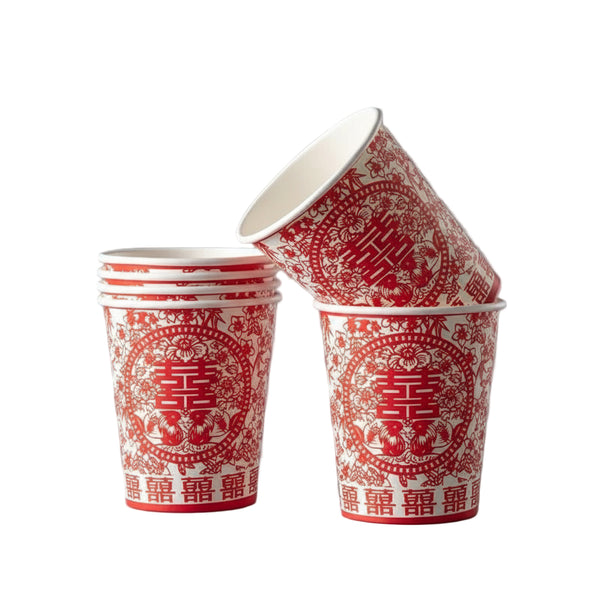 Red and white paper cups with Chinese characters on a dark background